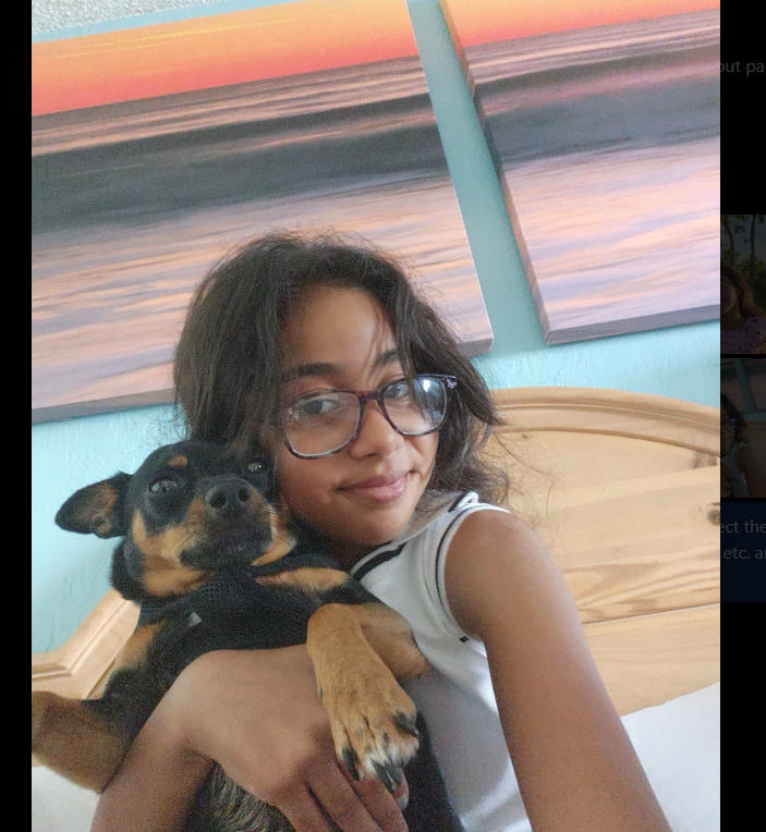 Rosie holding her puppy